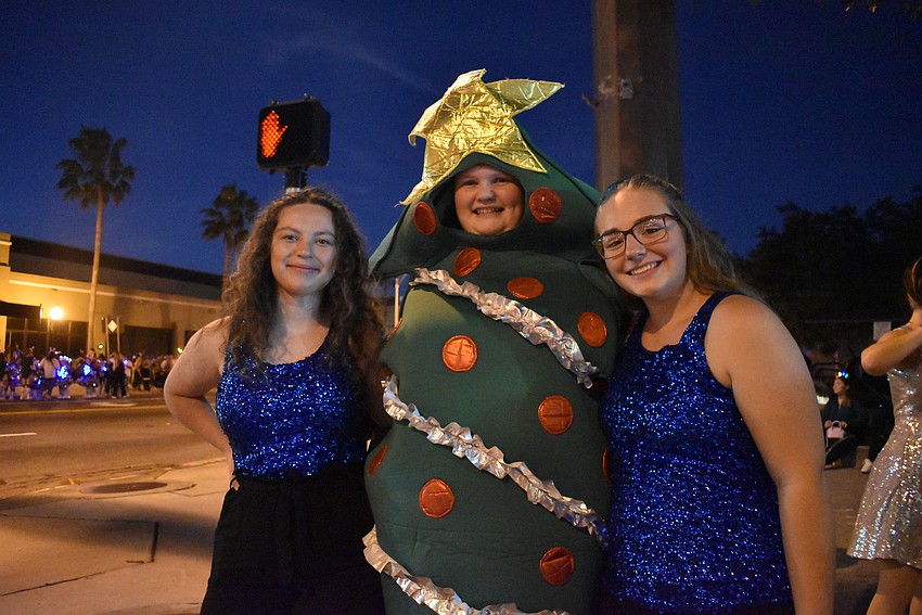 Kayleigh Pritchett, Alexandria Maulfair and Zoey Selby participate in the parade with Sarasota High School Theatre float.