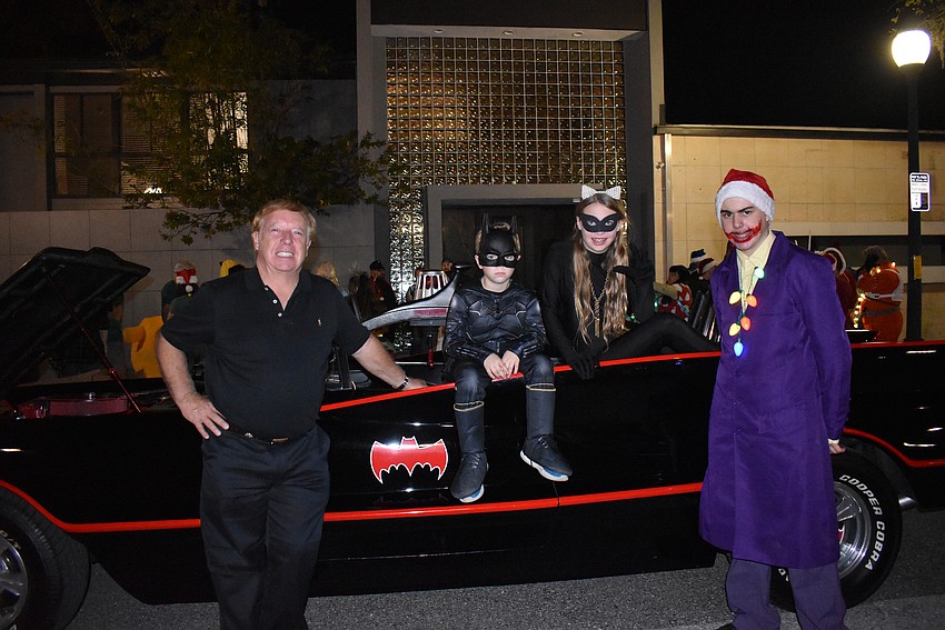 Eugene, Easton, Lt and Garrett Nock ride with The Dark Side Comics' batmobile.