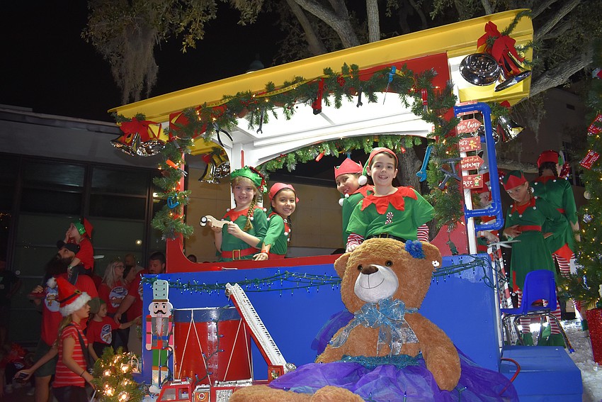Brooklyn Athridge, Santana Leyva, Sofia Leyva and AJ Athridge ride with Stage Door Studios float.