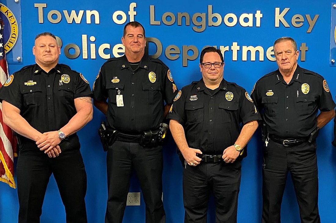 Captain Rick Hankins, Sgt. Lee Smith, Sgt. Sean Butler and Chief George Turner at Butler's promotion ceremony.