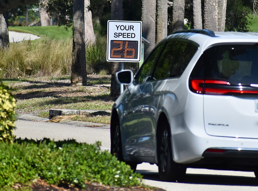 Traffic slows for a speed hump in Bay Isles. Traffic slows for a speed hump in Bay Isles.
