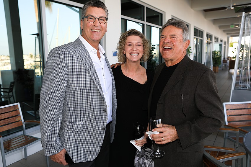 Lance and Amy Huebner with Mike Roberts