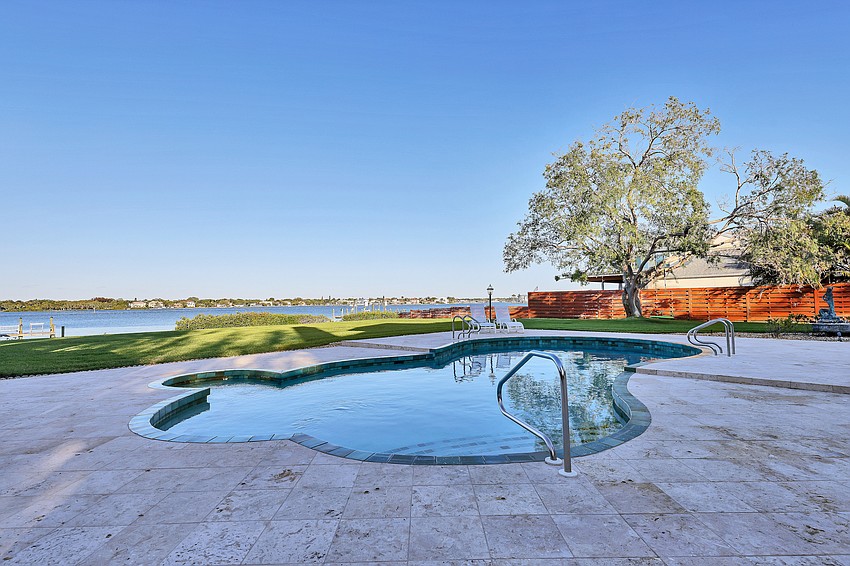 The property's pool and deck overlook Sarasota Bay.