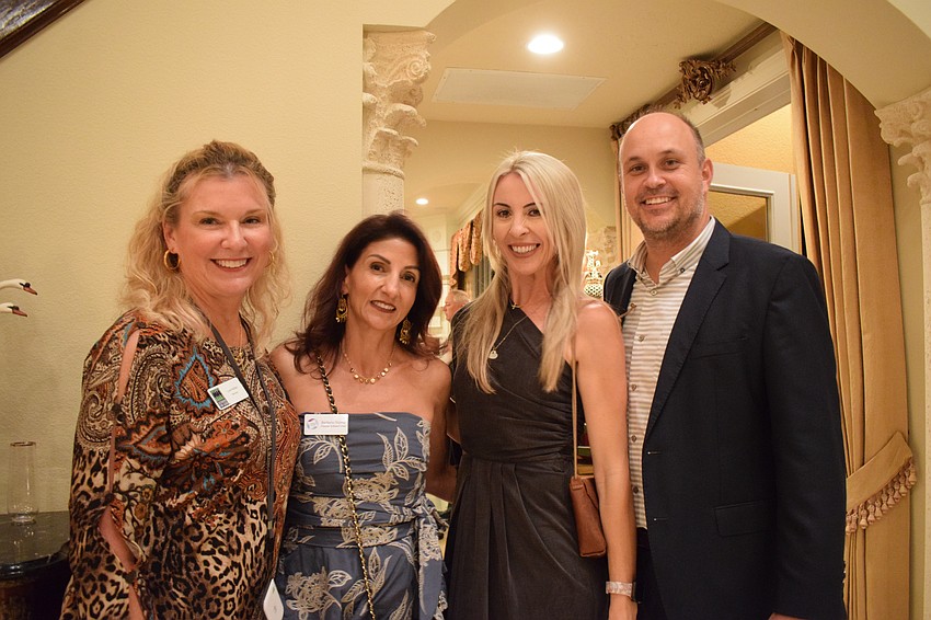 Lakewood Ranch's Lorri Kidder, Lake Club's Barbara Najmy and Sarasota's Ashley Gruters and her husband, Tim Gruters, learn more about Sisterhood for Good's mission. 