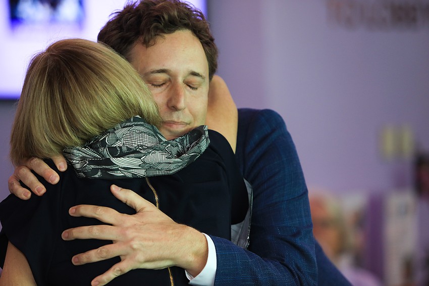 Brad Bryan embraces his mother.