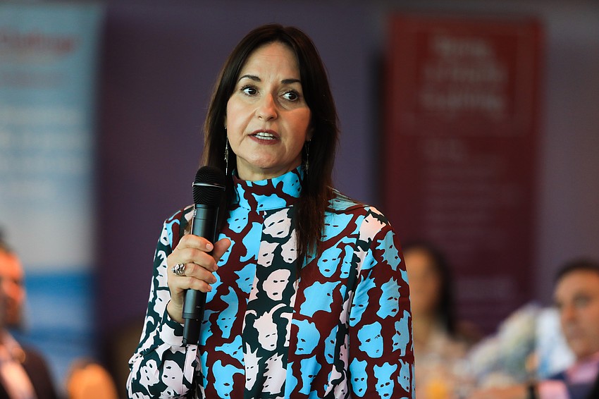 Chairwoman Aimee Chouinard tearfully recounts her own family's experiences with Parkinson's Disease.