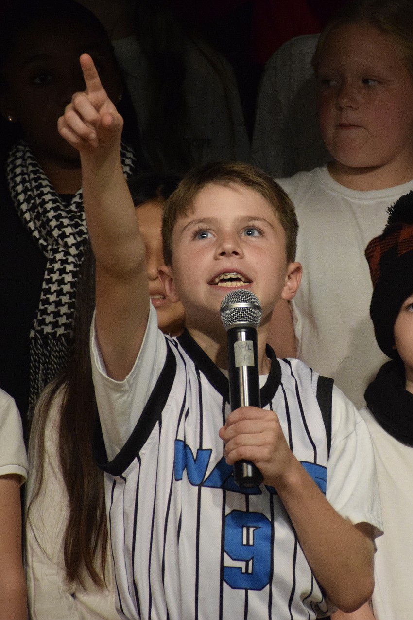 Dexter Trombetta, a fifth grader, is excited to see Santa arriving at Tara Elementary School.