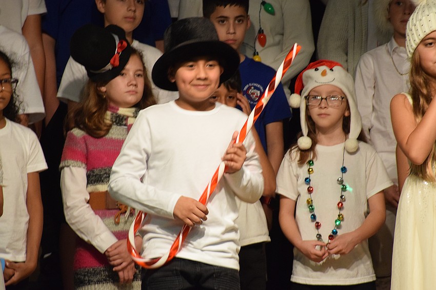 Eli Lopez, a fifth grader, rocks out on his candy cane.