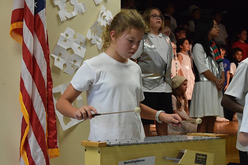Liana Sienkiewicz, a fifth grader, is focused while playing the xylophone.