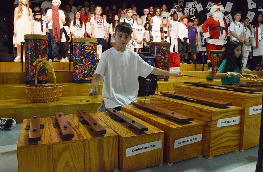 Connor Alfonso, a fifth grader, provides the beat to a song.