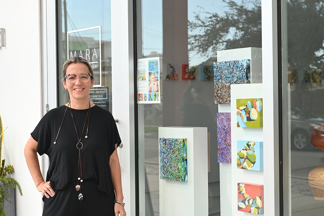 Mara Torres González stands outside her gallery, Mara Art Studio + Gallery, in the Rosemary District in October 2022.