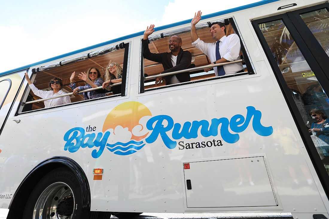 Members of the City Commission took the first ride on the Bay Runner trolley from downtown to Lido Key.