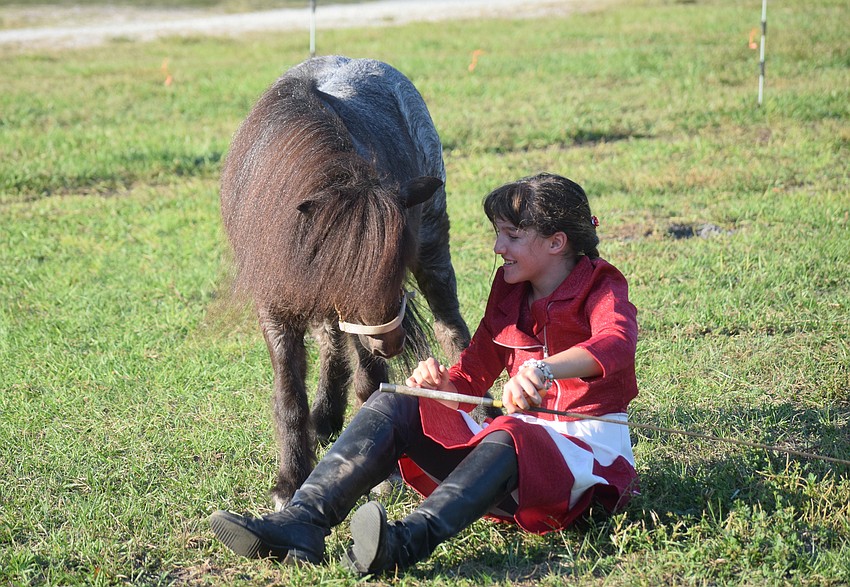 Willie and Sydney McCullough share a moment during a special Christmas event Saturday. The event continues Sunday and both Saturday and Sunday next weekend.