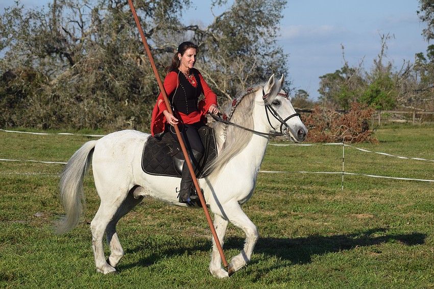 Rebecca McCullough rides Achilles during a special Christmas event Saturday at Herrmann's Royal Lipizzan Stallions in Myakka City. The regular shows begin Dec. 29.