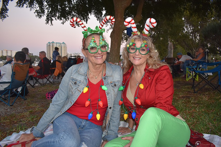 Patti Tebo and Darlene Marks wait for the boats to arrive.