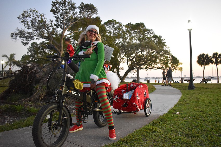Misty Pacheco and her dog Charlie ride through Bayfront Park in style.