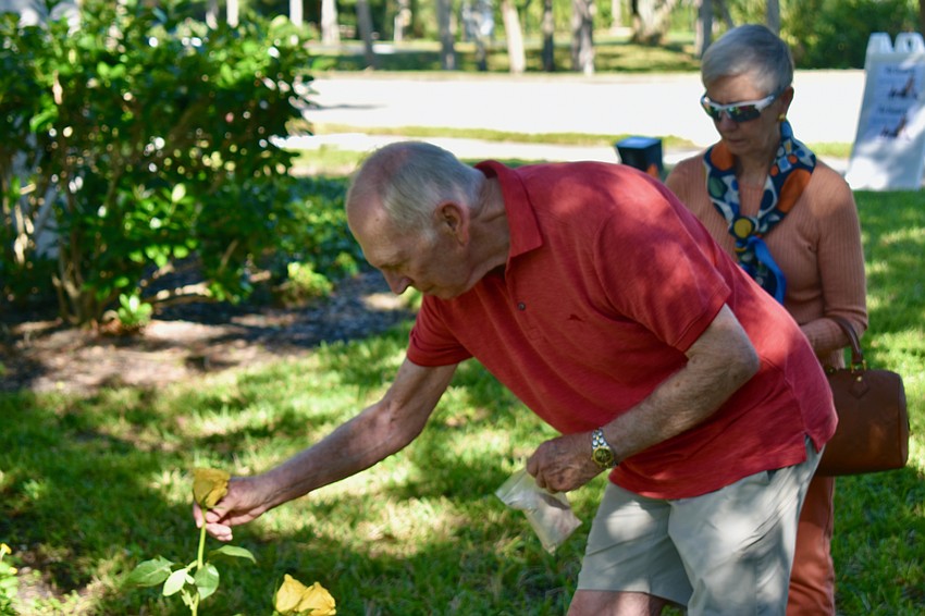 Jerry Bowles takes a rose to leave for Maggie as his wife Gay looks on.