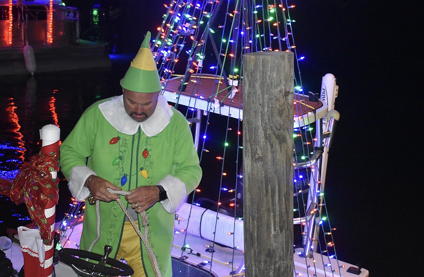 Bradenton's Tyson Peco ties down at Linger Lodge to have dinner.