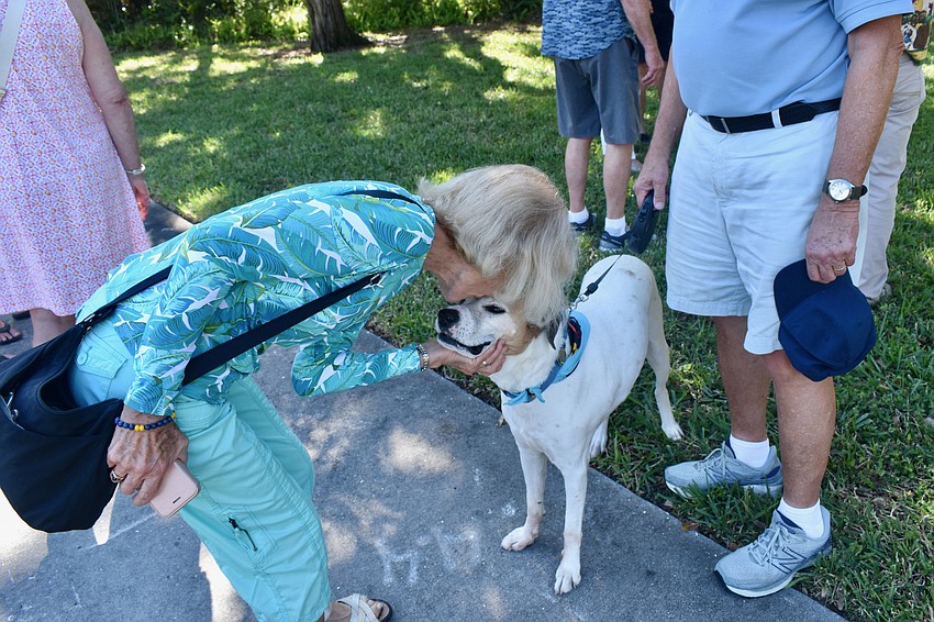 Diana Emerich-Cable gives Gustie a kiss after the blessing.