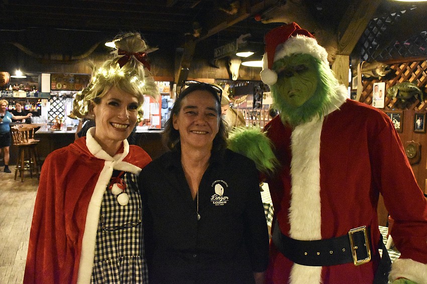 East County's Dee Boenau, Linger Lodge owner Rita Lewis, and Lisa Boenau's husband Jack Boenau meet after the boats arrive at the restaurant.