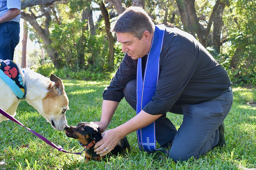 Pet blessing interrupted with Rev. David Marshall.