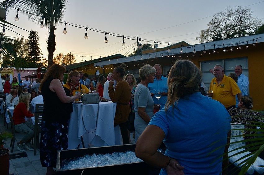 The patio at Harry's Continental Kitches fills up with Chamber of Commerce members.