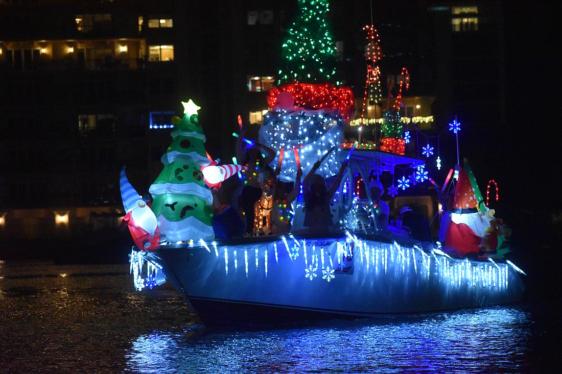 A brightly decorated boat drove through the Marina Jack Yacht Basin area during the 2022 Holiday Boat Parade of Lights.