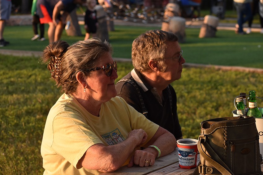 Bradenton's Sue and Rick Bouchard watch a performance by the band The Divebombers.