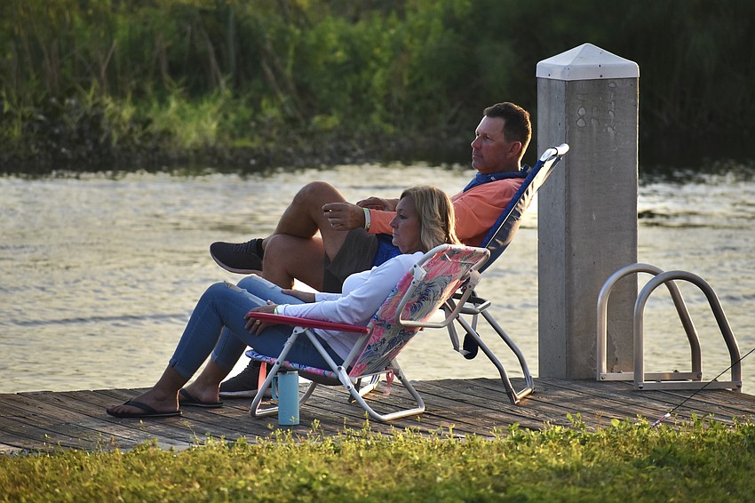 Bradenton's Kim and Ross Wright have the perfect seat to watch as the boats line up for the parade.