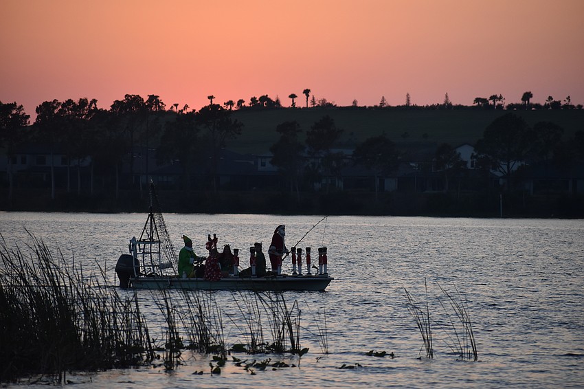 The Peco family awaits the start of the event from their boat.