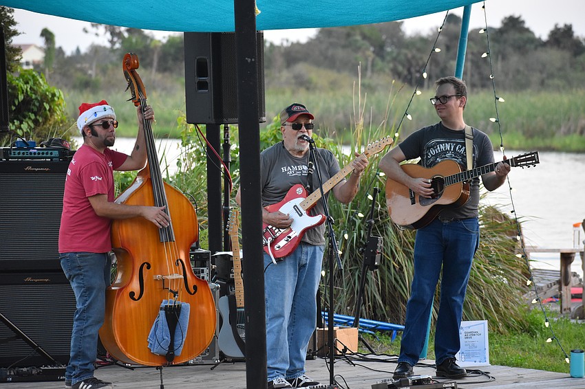 The Divebombers — Chad Clifford, George Worthmore and Nat Langston — perform prior to the parade.