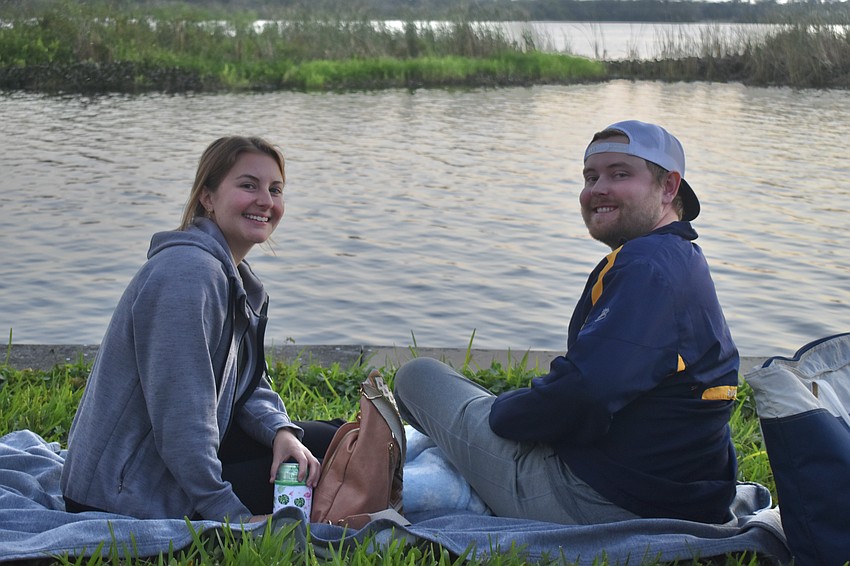 East County's Kristen Glor and McQuade Lyons have perfect seats to watch the Holiday Boat Parade.