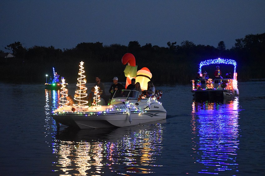 Boats approach Jiggs Landing at the end of the parade.