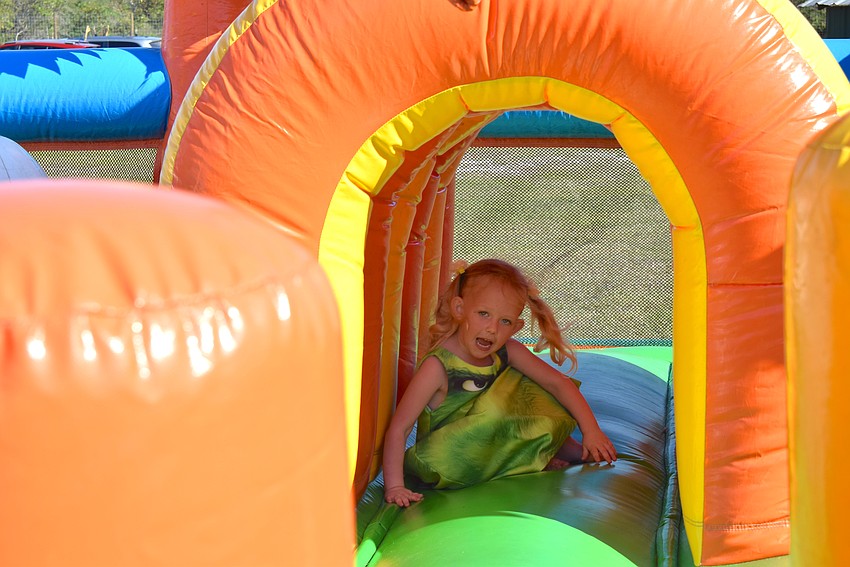 Myakka's Ava Jewel navigates her way through the inflatables at Bearadise Ranch.
