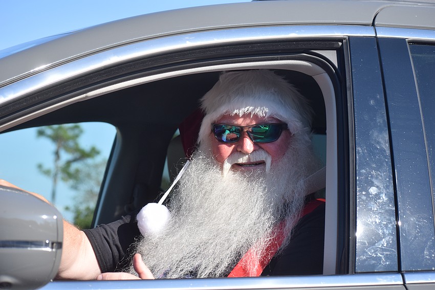 Santa's sleigh wasn't running so he arrived at Bearadise Ranch in a van. His alter ego is Palmetto's Tony Wilburn.