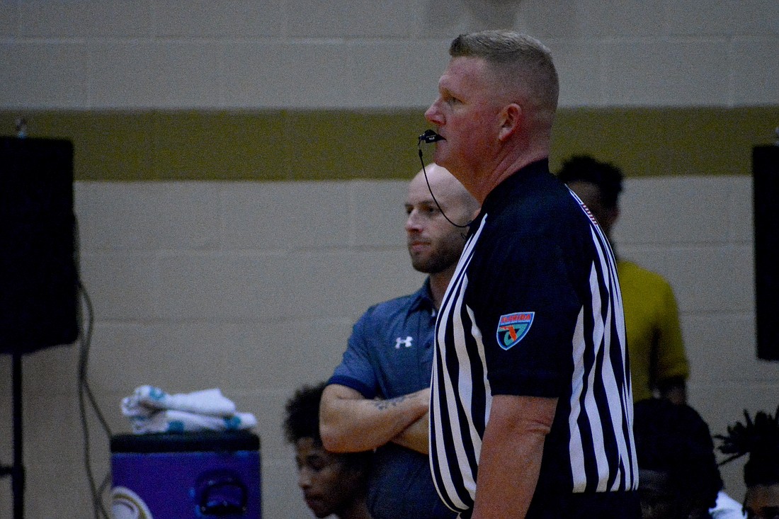 Sarasota High baseball Coach Greg Mulhollen spends some of his free time working as an area basketball referee.