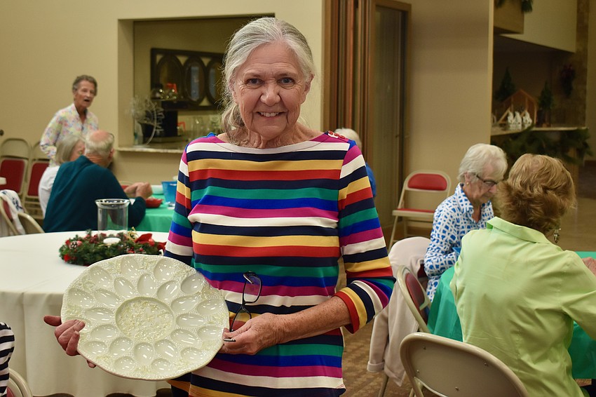 Carol Cornwell wins a deviled egg platter.