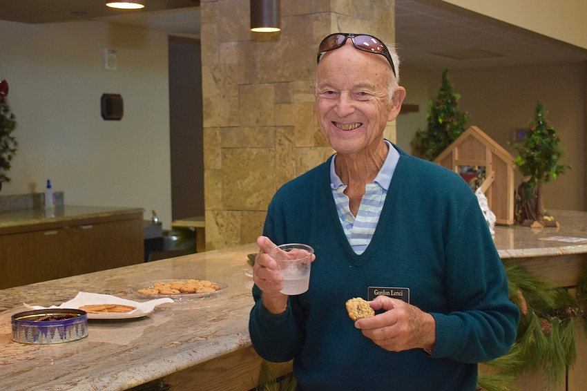 Gordon Lenci takes a break to grab a cookie.
