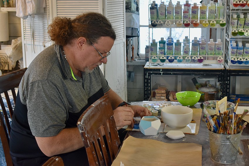 Michael Nunes is the first to start painting.