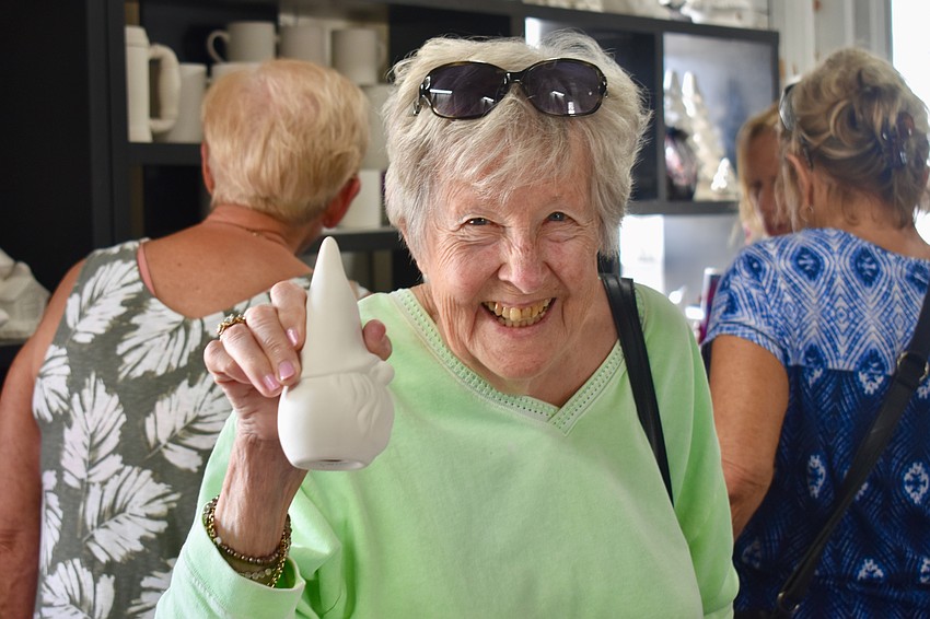 Cindy Kuehnel chooses a gnome she named Elmer.