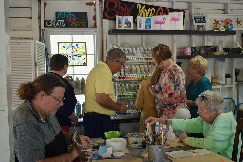 Members of the Longboat Island Chapel enjoy a field trip to the Artful Giraffe in Sarasota.