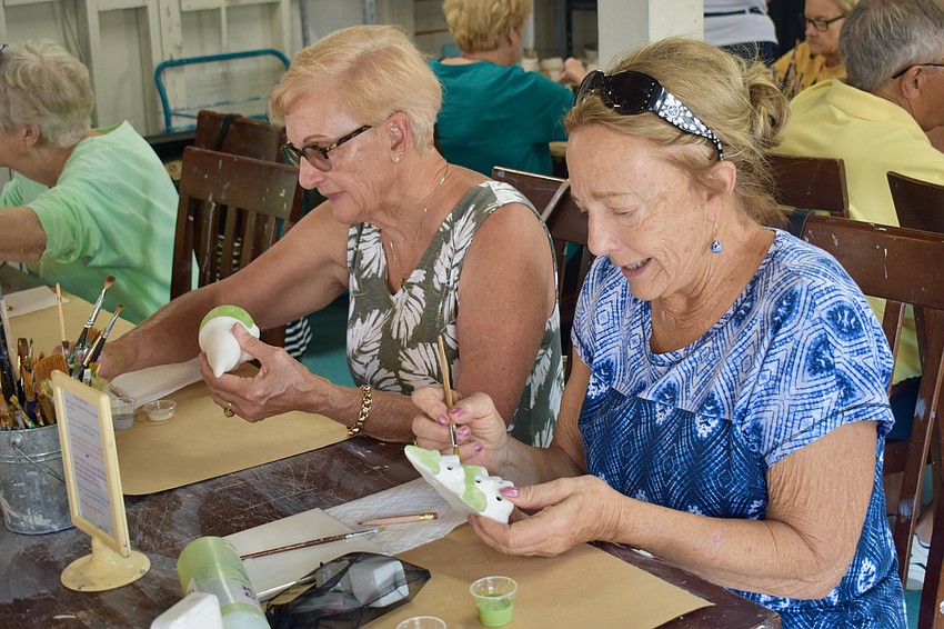 Ginger Stefan and Donna Dolan busy painting.