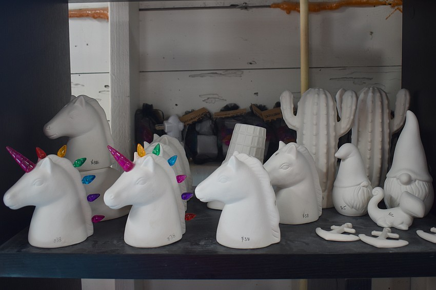 Church members have their choice of ceramics to paint.