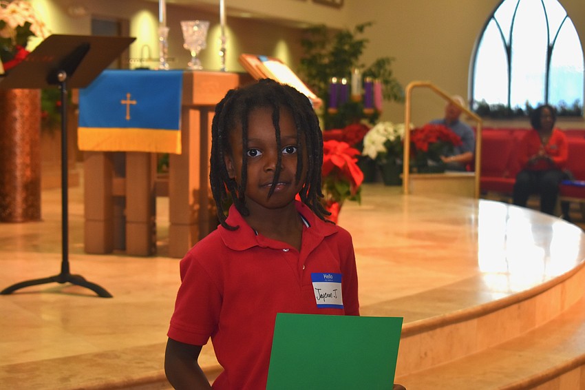Jayceon Johnson leaves the podium after reading 