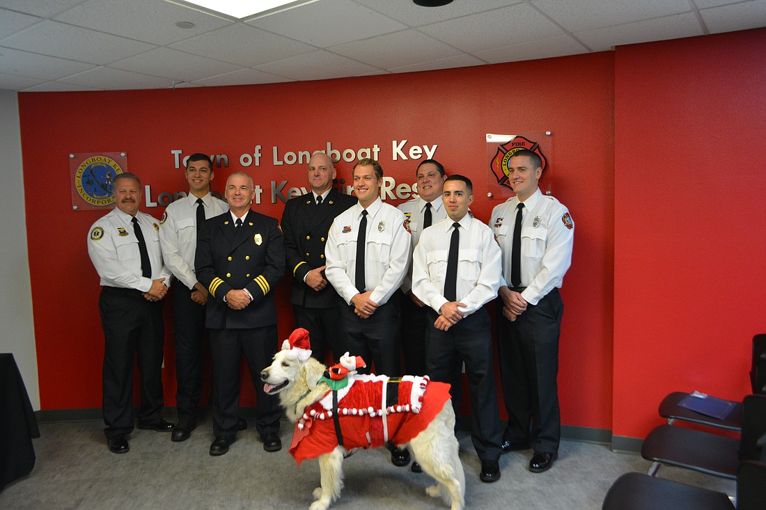 Lt. Ron Koper, Firefighter/Paramedic Tyler Anderson, Assistant Chief Mike Regnier, Lt. Tim Haas, FF/P David Oliger, FF/P Jason Berzowski, FF/P Daniel Martinez, FF/P William Lewis and Therapy Dog Hunter