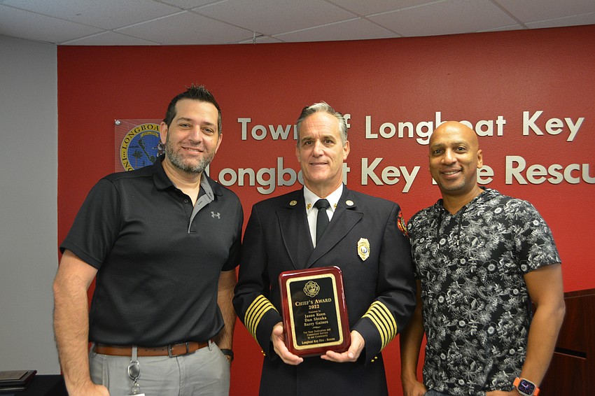 Jason Keen, Chief Paul Dezzi and Barry Gaines. Gaines and Keen received the 2022 Chief's Award on behalf of the town's IT department.
