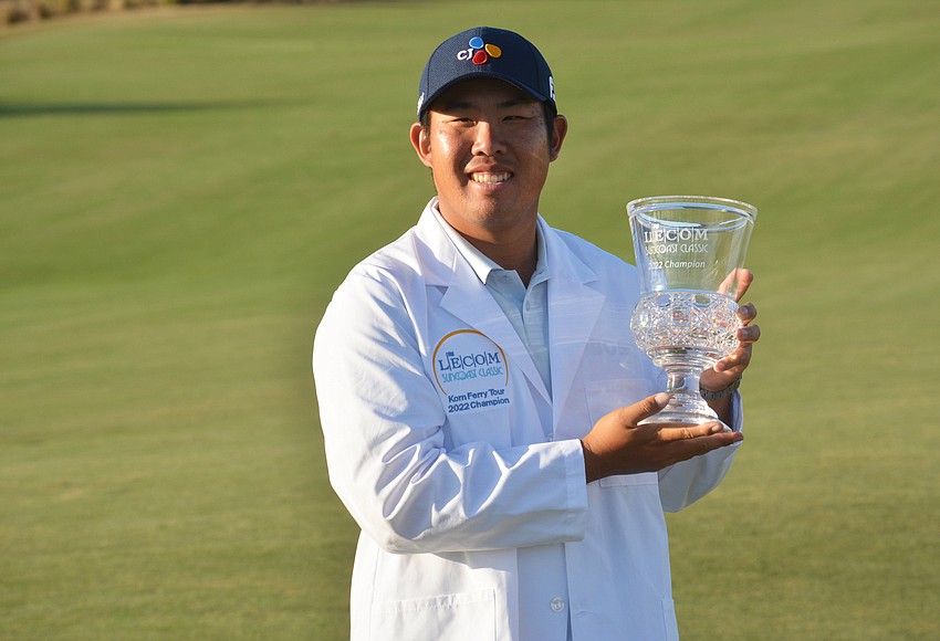 Your Observer Photo Byeong Hun An holds up the 2022 Suncoast