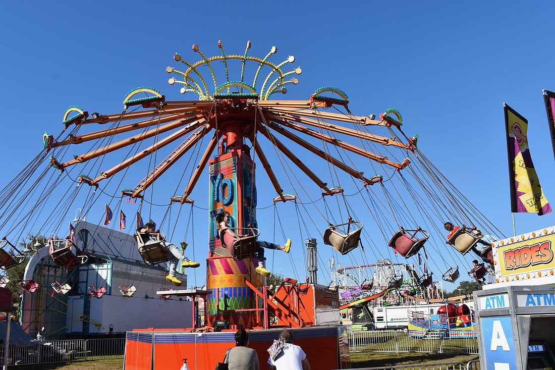 Riders enjoy a flight on the Yo Yo ride at the Manatee County Fair.
