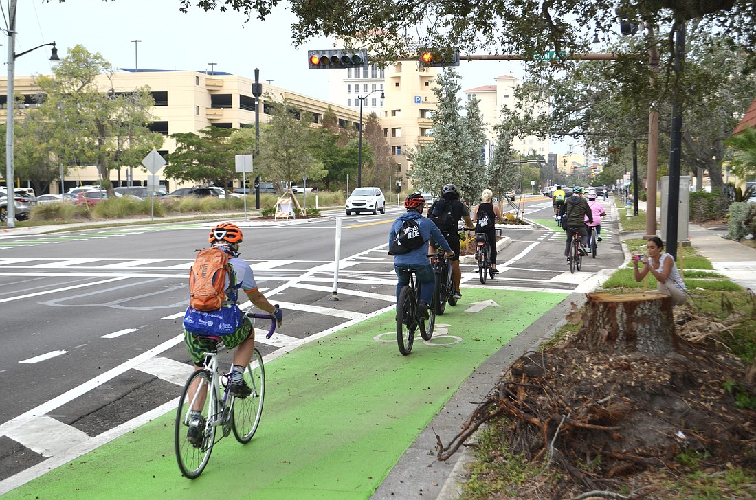 Bicyclists take the ceremonial inaugural ride on the Ringling Trail bike lane starting at Legacy Trail.