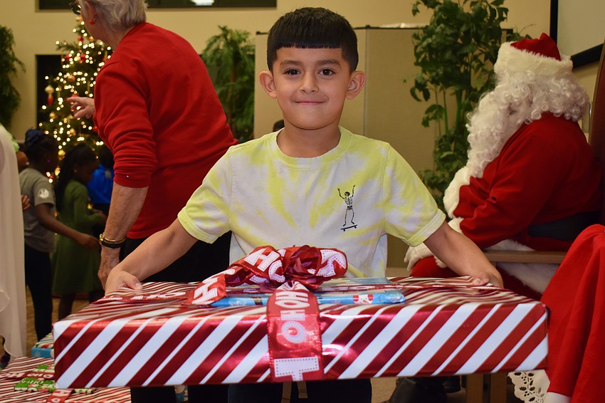 Leovanni Cruz gets a big gift from Santa.